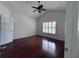 Bright bedroom with hardwood floors, ceiling fan, and a large window at 1297 Segar St, Johns Island, SC 29455