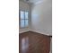 Bedroom featuring wood floors and window shutters, offering a bright and airy atmosphere at 1297 Segar St, Johns Island, SC 29455
