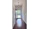 Bright entryway boasting gleaming hardwood floors and a modern door with natural light at 1297 Segar St, Johns Island, SC 29455