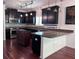 Beautiful kitchen with dark cabinets, granite countertops and plenty of countertop space at 1297 Segar St, Johns Island, SC 29455