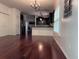 Spacious living room with dark wood floors, open to the kitchen area with a view to dining at 1297 Segar St, Johns Island, SC 29455