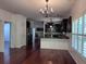 View of the open-concept living room and modern kitchen with stainless steel appliances at 1297 Segar St, Johns Island, SC 29455
