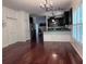 Spacious living room with dark wood floors, open to the kitchen area with a view to dining at 1297 Segar St, Johns Island, SC 29455