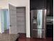 Featuring stainless steel fridge and access to a pantry with shelving space at 1297 Segar St, Johns Island, SC 29455