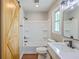 Modern bathroom showcasing a bathtub/shower combination and a stylish barn door detail at 131 Ponderosa Dr, Ladson, SC 29456