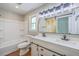 Bright bathroom featuring a double vanity, modern fixtures, and a sliding barn door at 131 Ponderosa Dr, Ladson, SC 29456