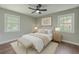 Bright bedroom featuring large windows, wood floors, and neutral decor at 131 Ponderosa Dr, Ladson, SC 29456