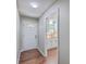 Light and airy home entryway with hardwood floors and a view into the kitchen at 131 Ponderosa Dr, Ladson, SC 29456