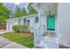 Welcoming white brick home featuring a bright teal front door and well-kept landscaping at 131 Ponderosa Dr, Ladson, SC 29456