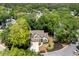 An aerial view of a beautifully landscaped property nestled among mature trees, providing privacy and a serene setting at 1337 Horseshoe Bnd, Mount Pleasant, SC 29464