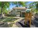 Large backyard offering a patio, screened porch, play area, and lush greenery at 1337 Horseshoe Bnd, Mount Pleasant, SC 29464