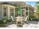 Charming backyard patio area with a table and chairs, perfect for outdoor dining at 1337 Horseshoe Bnd, Mount Pleasant, SC 29464