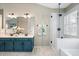 Bathroom with double sinks, an extra large mirror, glass enclosed shower, and soaking tub at 1337 Horseshoe Bnd, Mount Pleasant, SC 29464