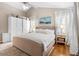 Bright bedroom features a neutral color scheme, hardwood floors, and a large wardrobe at 1337 Horseshoe Bnd, Mount Pleasant, SC 29464