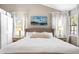 Well-lit bedroom with white walls, two windows and a calming blue picture on the wall at 1337 Horseshoe Bnd, Mount Pleasant, SC 29464