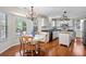 Bright dining area featuring a chandelier, breakfast nook and modern kitchen in an open concept at 1337 Horseshoe Bnd, Mount Pleasant, SC 29464