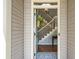Entryway view showcasing stairs with white railing, a decorative rug and hardwood floors at 1337 Horseshoe Bnd, Mount Pleasant, SC 29464