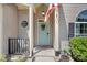Inviting front porch with a light blue door, decorated with a welcome wreath and American flag at 1337 Horseshoe Bnd, Mount Pleasant, SC 29464