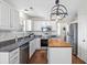 Modern kitchen with white cabinets, stainless steel appliances, and a wood-topped island at 1337 Horseshoe Bnd, Mount Pleasant, SC 29464