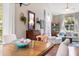 Inviting living room and dining area featuring hardwood floors and neutral tones and large windows at 1337 Horseshoe Bnd, Mount Pleasant, SC 29464