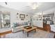 Comfortable living room area open to the kitchen features bright windows and a ceiling fan at 1337 Horseshoe Bnd, Mount Pleasant, SC 29464