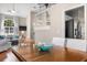 Bright living room and dining area featuring hardwood floors, stainless steel appliances and stairs to the second floor at 1337 Horseshoe Bnd, Mount Pleasant, SC 29464