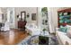 Bright living room boasting hardwood floors, arched windows, and stylish furnishings, ideal for relaxation and entertaining at 1337 Horseshoe Bnd, Mount Pleasant, SC 29464