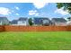 Spacious backyard with green grass and a wooden fence, perfect for outdoor activities at 139 Spindle Way, Goose Creek, SC 29445