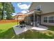 Back patio with grill, shade umbrella and screened in porch, perfect for relaxing or entertaining at 139 Spindle Way, Goose Creek, SC 29445