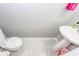 Half bathroom featuring a pedestal sink and toilet with gray walls and marble-style floors at 139 Spindle Way, Goose Creek, SC 29445
