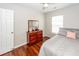 Bedroom featuring hardwood floors, a dresser with a mirror, and a window with natural light at 139 Spindle Way, Goose Creek, SC 29445