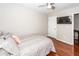 Bedroom with hardwood floors, a television on the wall, and neutral paint at 139 Spindle Way, Goose Creek, SC 29445