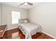 Bedroom with hardwood flooring, a window with blinds, and a ceiling fan, making for comfortable living at 139 Spindle Way, Goose Creek, SC 29445