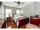 Bedroom featuring hardwood floors, ceiling fan, and a comfortable bed with a gray and white blanket at 139 Spindle Way, Goose Creek, SC 29445