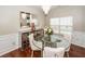 Dining room features a glass table, mirrored sideboard, and bright window at 139 Spindle Way, Goose Creek, SC 29445