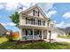 Charming two-story home with a welcoming front porch and well-maintained landscaping at 139 Spindle Way, Goose Creek, SC 29445
