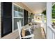 Inviting front porch with rocking chairs, cushions, and a cozy seating area at 139 Spindle Way, Goose Creek, SC 29445