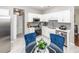 Bright kitchen featuring white cabinetry, stainless steel appliances, and gray subway tile backsplash at 139 Spindle Way, Goose Creek, SC 29445