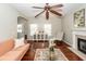 Cozy living room with a fireplace, stylish furniture, and hardwood floors at 139 Spindle Way, Goose Creek, SC 29445