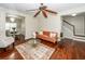 Open concept living room featuring hardwood floors, stylish furniture, and a view of the staircase at 139 Spindle Way, Goose Creek, SC 29445
