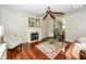 Bright living room features hardwood floors, a fireplace, and a view into the dining area at 139 Spindle Way, Goose Creek, SC 29445
