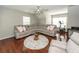 Spacious living room with sectional seating, hardwood floors, and an abundance of natural light at 139 Spindle Way, Goose Creek, SC 29445