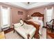 Main bedroom showcasing tray ceilings, a carved bed frame, and elegant seating at 139 Spindle Way, Goose Creek, SC 29445