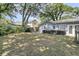 Expansive backyard with a mix of grassy areas and trees, providing a serene outdoor retreat at 1406 Glencoe Dr, Mount Pleasant, SC 29464