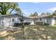 Spacious backyard featuring a lush lawn and convenient access to the house at 1406 Glencoe Dr, Mount Pleasant, SC 29464
