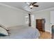 Cozy bedroom with hardwood floors, ceiling fan, and a classic dresser at 1406 Glencoe Dr, Mount Pleasant, SC 29464