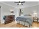 Inviting bedroom with hardwood floors, ceiling fan, and a large window for natural light at 1406 Glencoe Dr, Mount Pleasant, SC 29464
