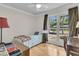 Bright bedroom with hardwood floors, a large window, and a twin bed at 1406 Glencoe Dr, Mount Pleasant, SC 29464