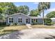 Attractive home with a circular driveway and neatly landscaped front yard at 1406 Glencoe Dr, Mount Pleasant, SC 29464