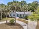 Inviting home exterior with well-manicured landscaping and a circular driveway at 1406 Glencoe Dr, Mount Pleasant, SC 29464